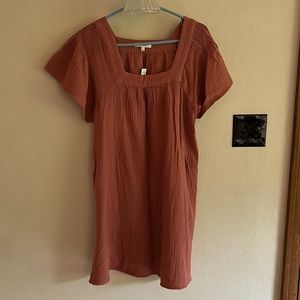 Never worn. Tags on. Dusty rose gauze dress with pockets